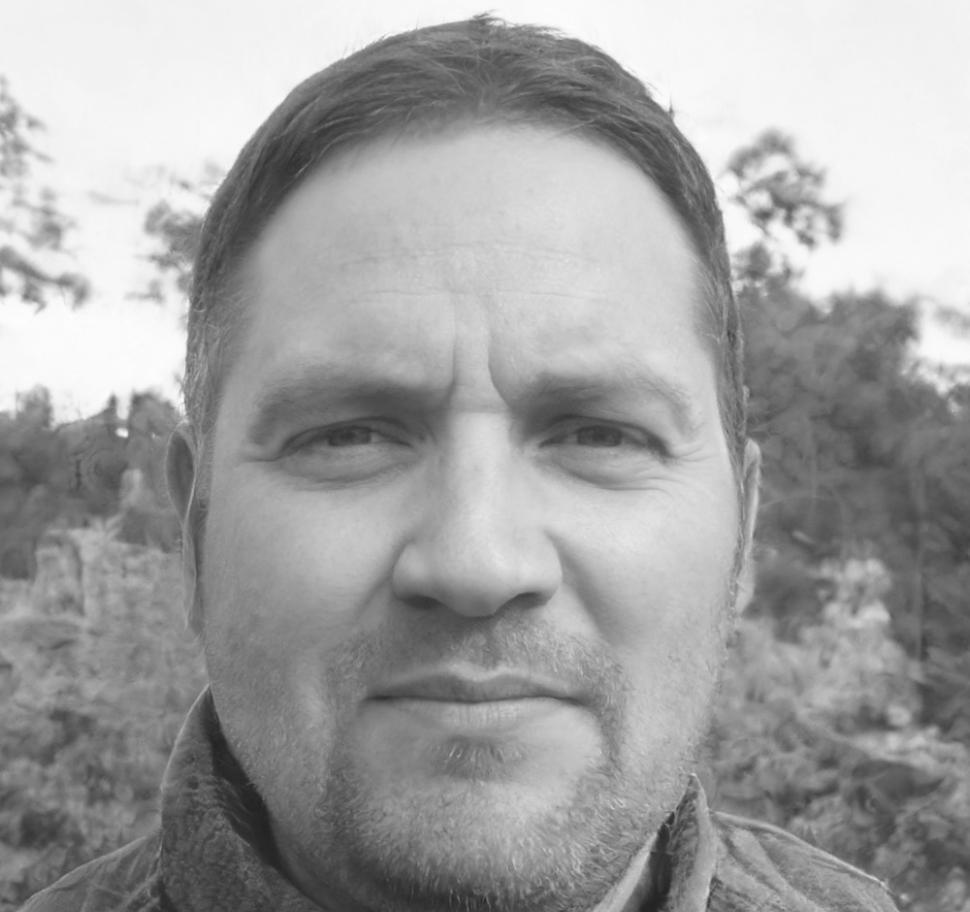 Professional male instructor explaining budget analysis concepts during financial training session