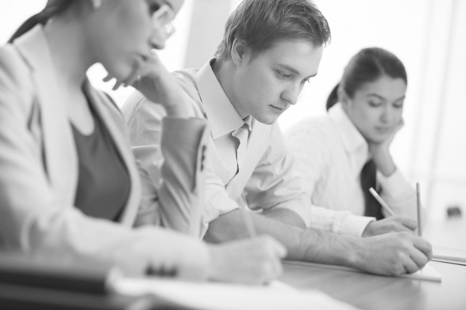 Financial analyst reviewing detailed budget performance charts and metrics on computer screen